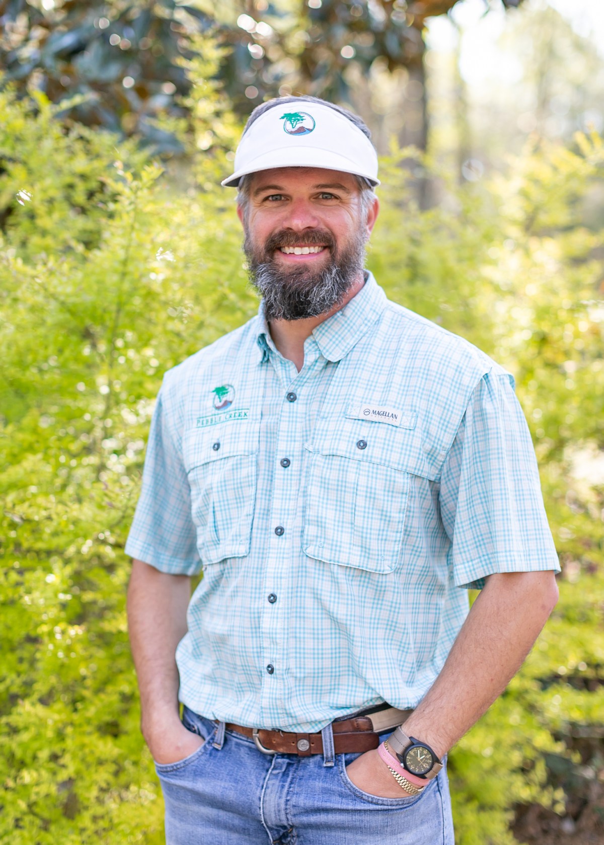 Ryan Kroger, founder of Pebble Creek Designs, in a Pebble Creek shirt and visor